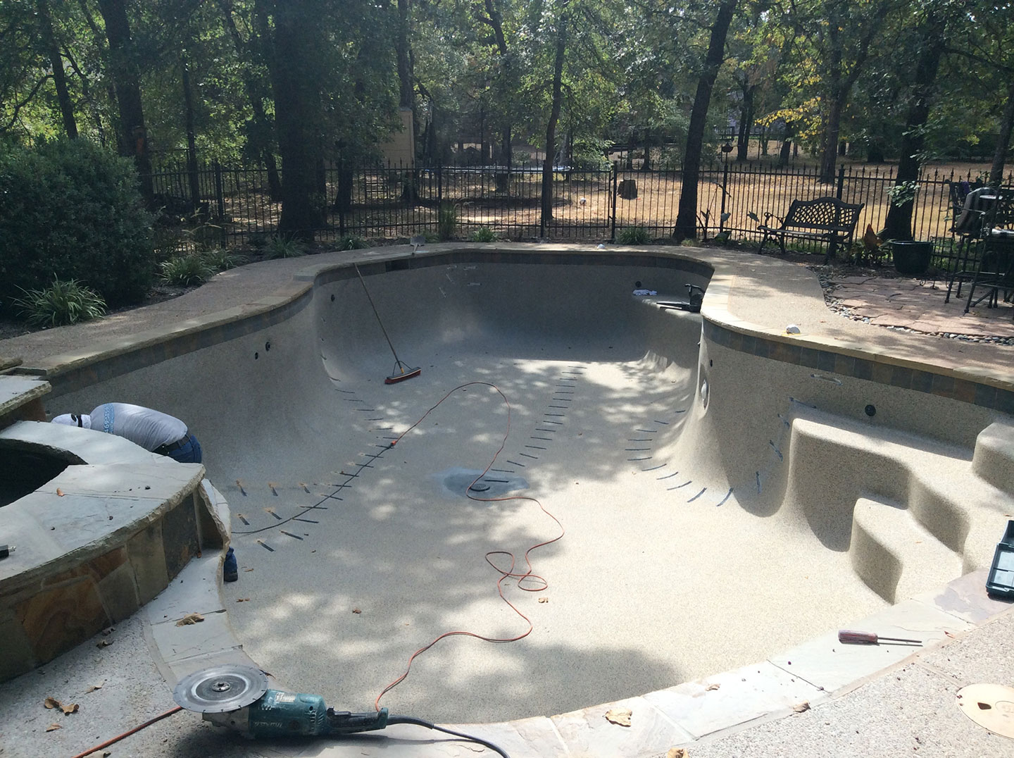 Empty Pool being Repaired.